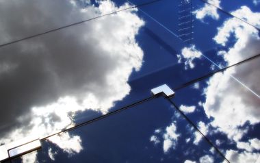 Blue Sky Reflection On Skyscraper Glass Facade