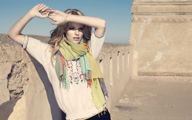 Bohemian Fashion Model Portrait Near Desert Adobe Buildings