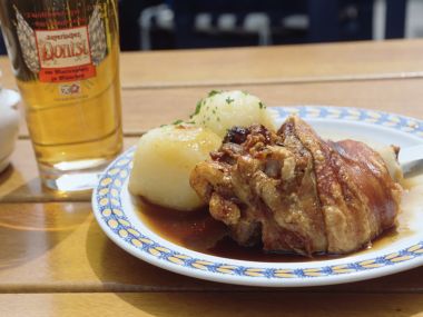 Bavarian Roasted Pork Knuckle With Potato Dumplings And German Beer