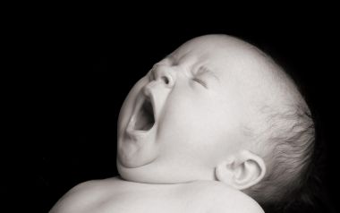 Black And White Yawning Newborn Baby Close Up Photo