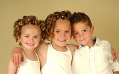 Warm Portrait Of Three Lovely Siblings Children