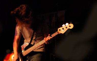 Livehouse Long Haired Bassist Playing Electric Bass