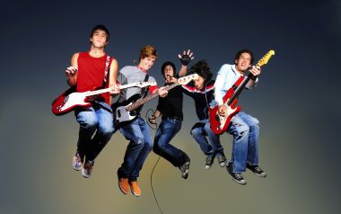 Energetic Young Rock Band Jumping Together Creative Photography