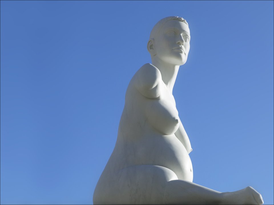 White Human Sculpture With Blue Sky Background