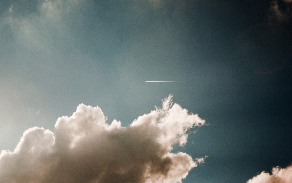 Blue Sky White Clouds And Airplane Contrail Peaceful Sky