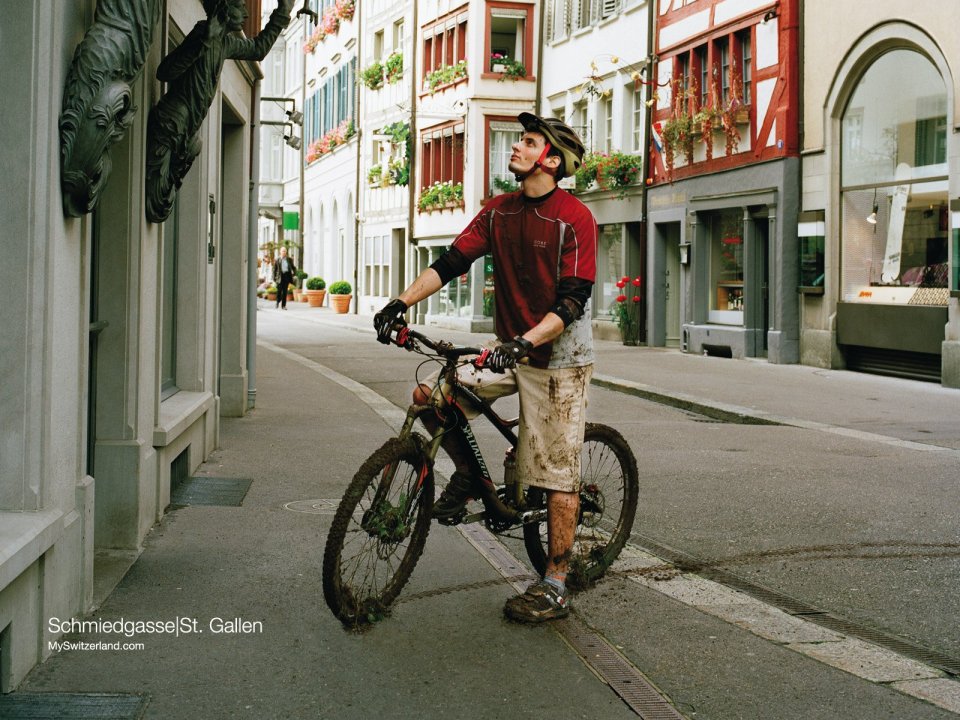 Cyclist On Schmiedgasse Street In St. Gallen Switzerland