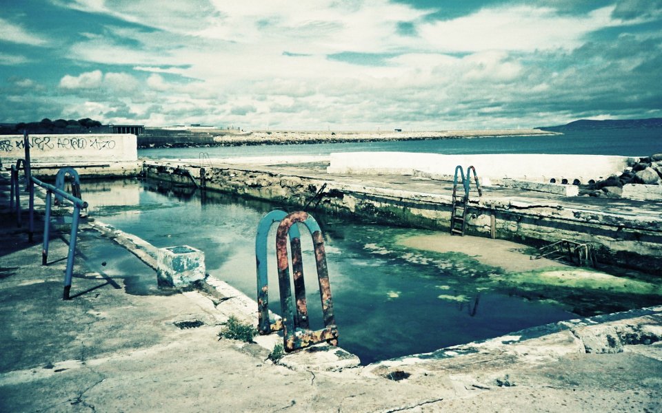 Lomo Style Derelict Pool And Seascape