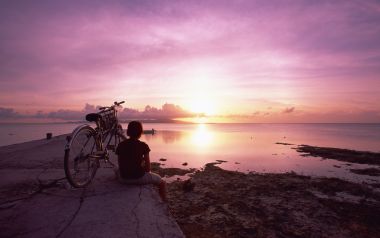 Japan Okinawa Beach Sunset With Bicycle Silhouette