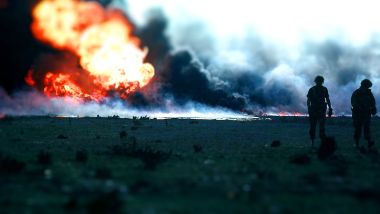 Tilt Shift Photography Of Wasteland Fire And Silhouettes