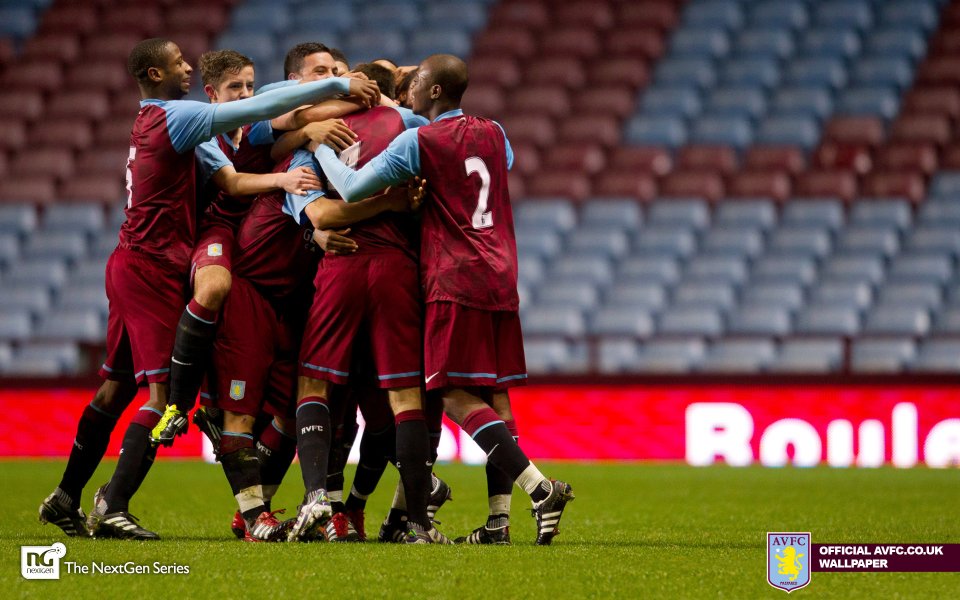 Aston Villa Fc Youth Players Celebrating On Football Pitch