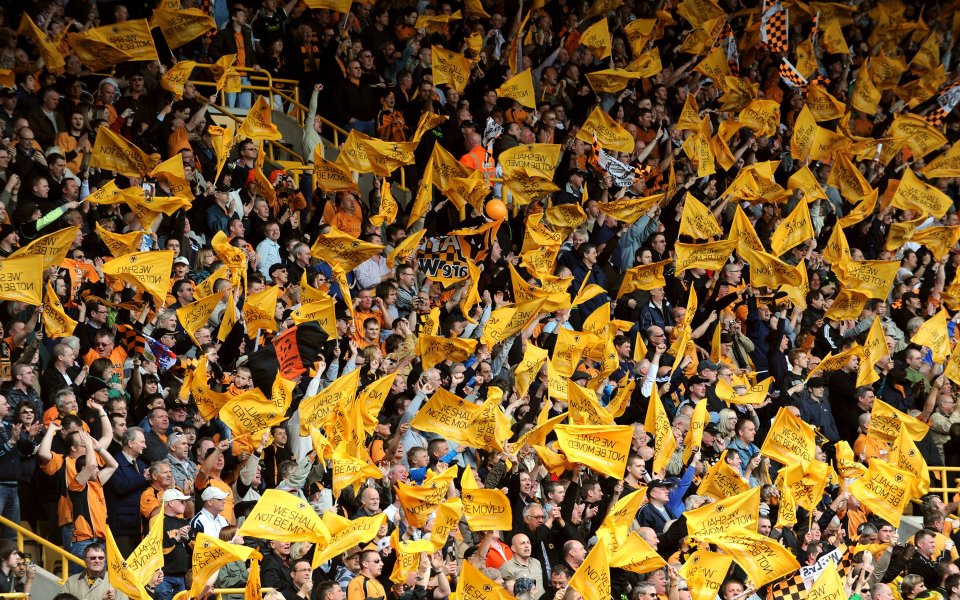 Wolverhampton Wanderers Fans Waving Yellow Flags At Home Stadium