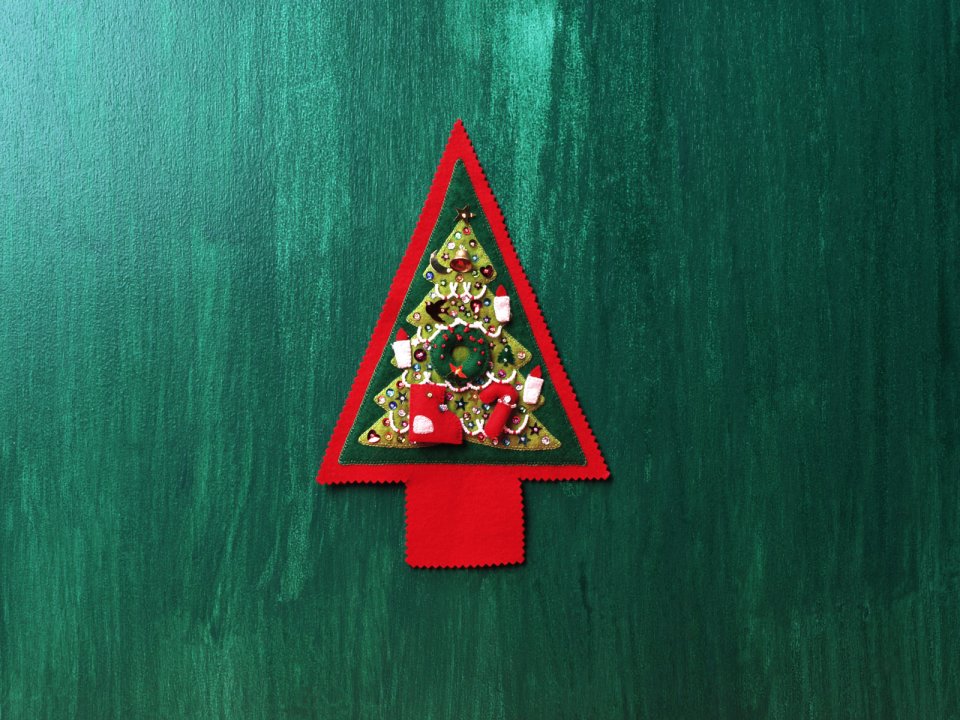 Handmade Felt Christmas Tree On Green Wood Background