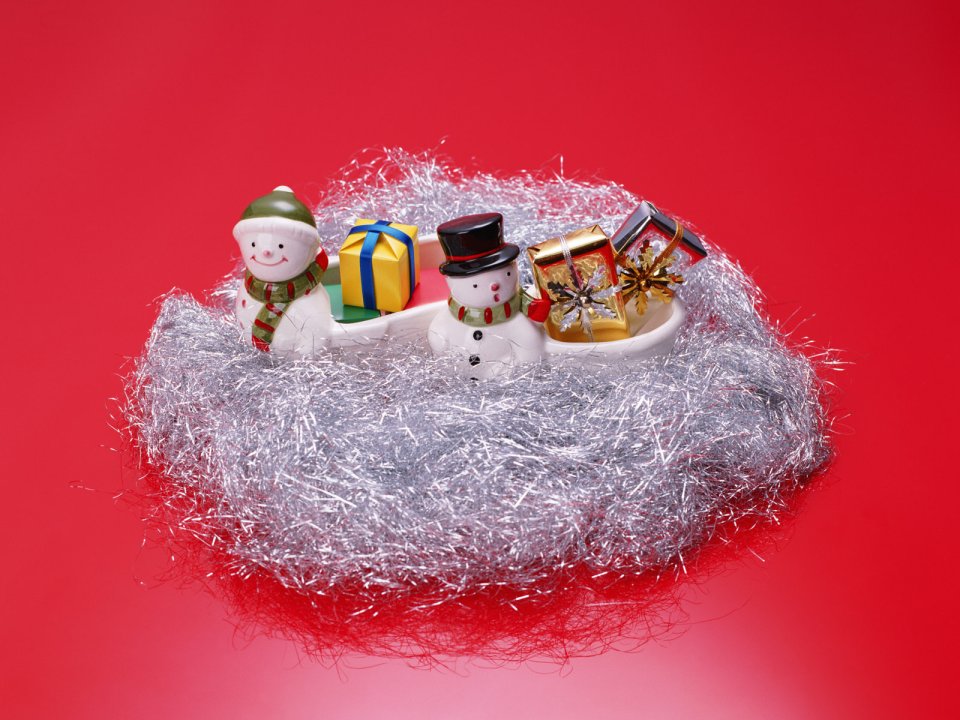 Snowman Toys And Christmas Gifts On Red Background