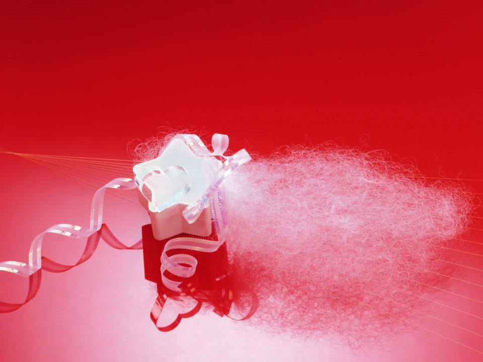Gift Box With Dreamy Fibers On Red Background