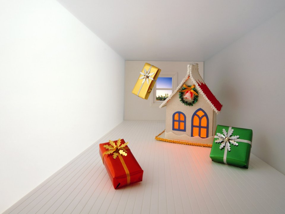 Christmas Gingerbread House And Gifts In White Room