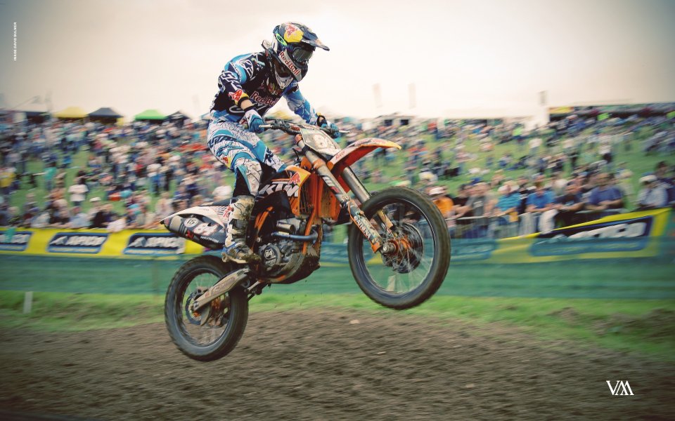 Motocross Rider Jumping Dirt Track