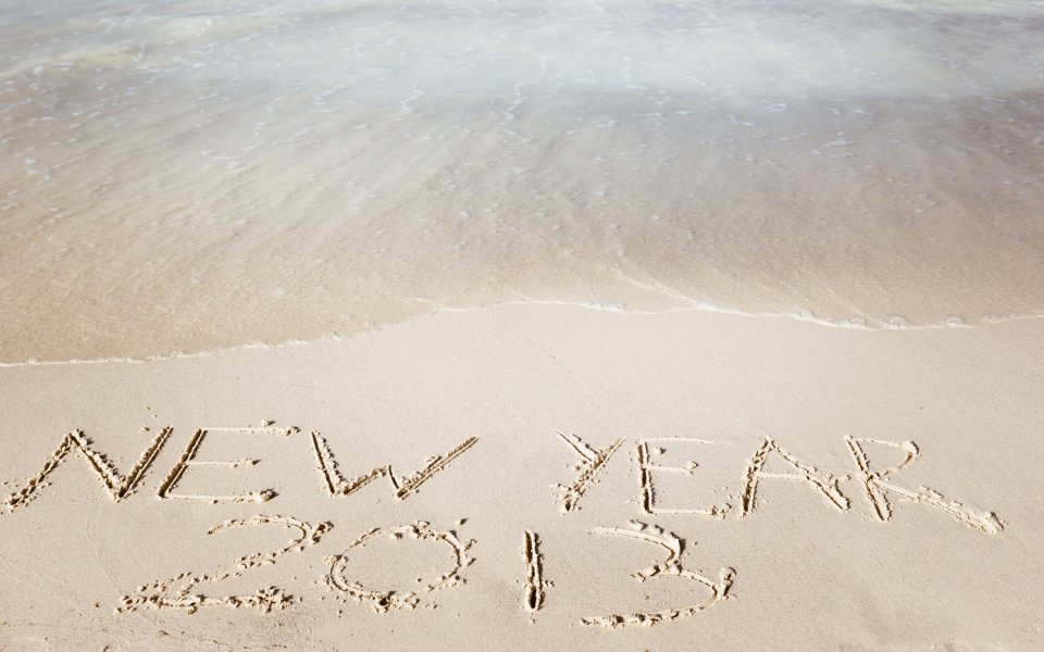 New Year 2013 Written In Sand By Ocean Waves