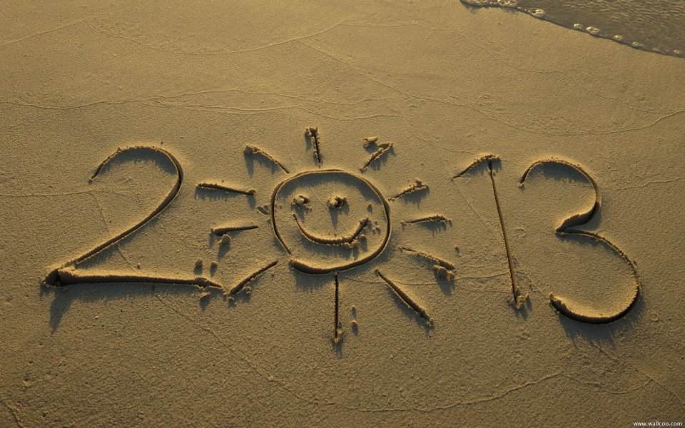 2013 And Smiley Sun Drawn In Golden Sand