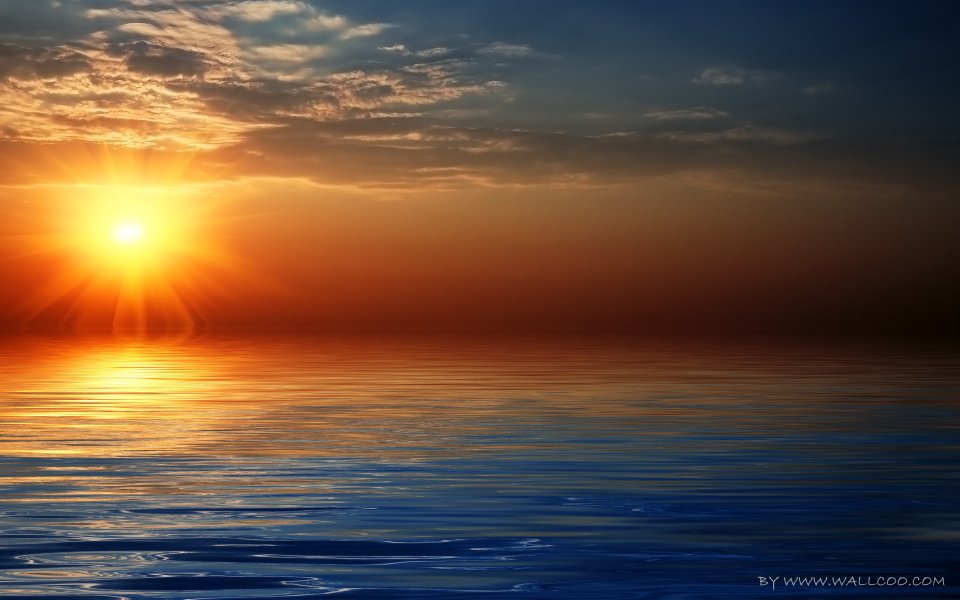 Sunrise Over Calm Sea With Golden Sunlight Reflection