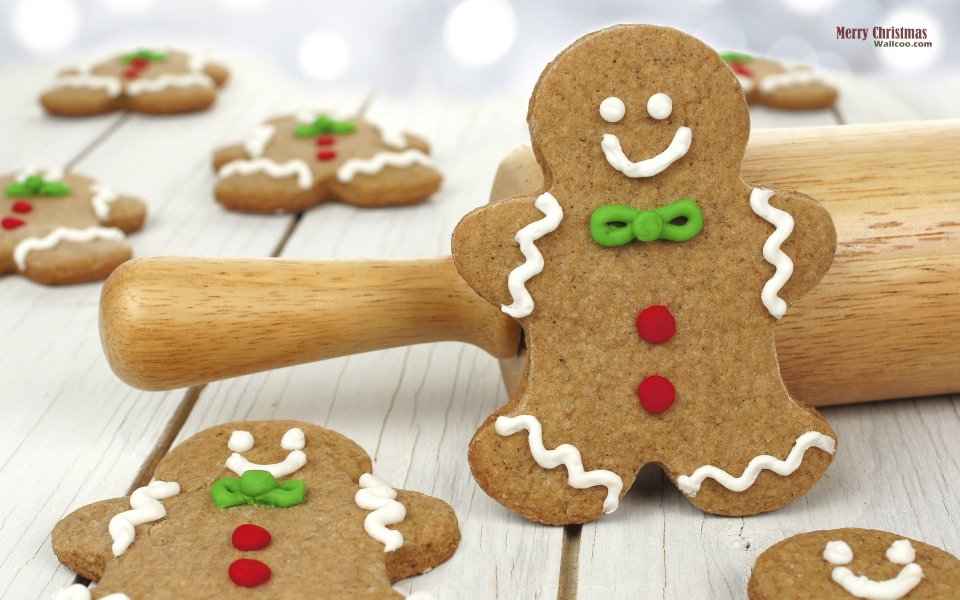 Christmas Gingerbread Men With Rolling Pin On White Wood