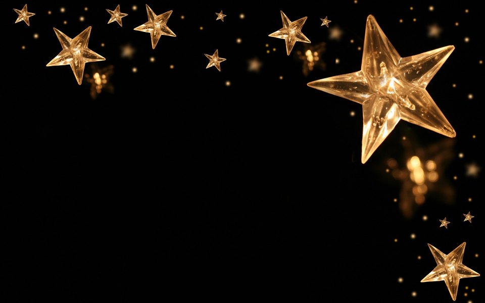 Golden Crystal Stars On Black Background