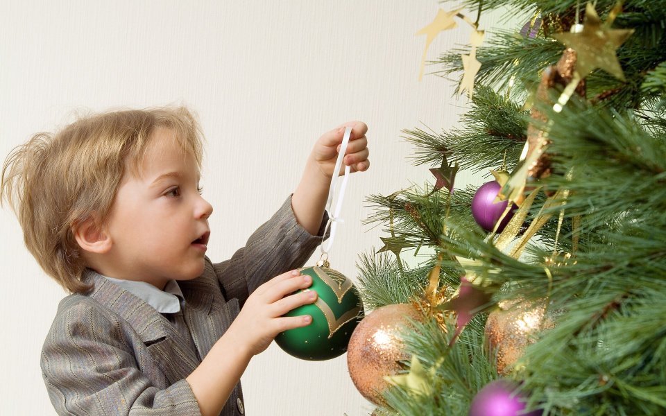 Little Boy Decorating Christmas Tree