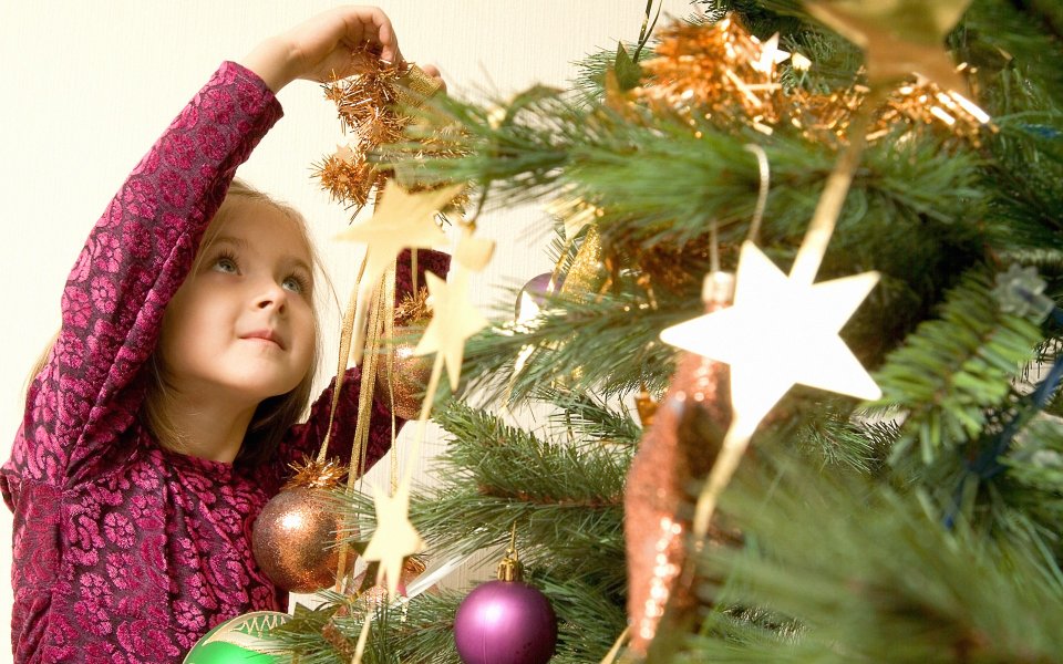 Little Girl Decorating Christmas Tree