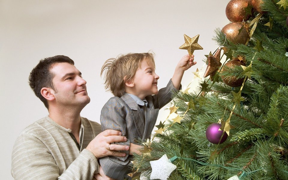 Father And Son Decorating Christmas Tree