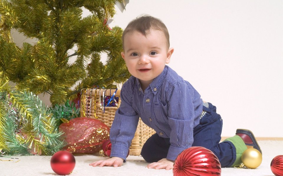 Smiling Baby Crawling By Christmas Tree