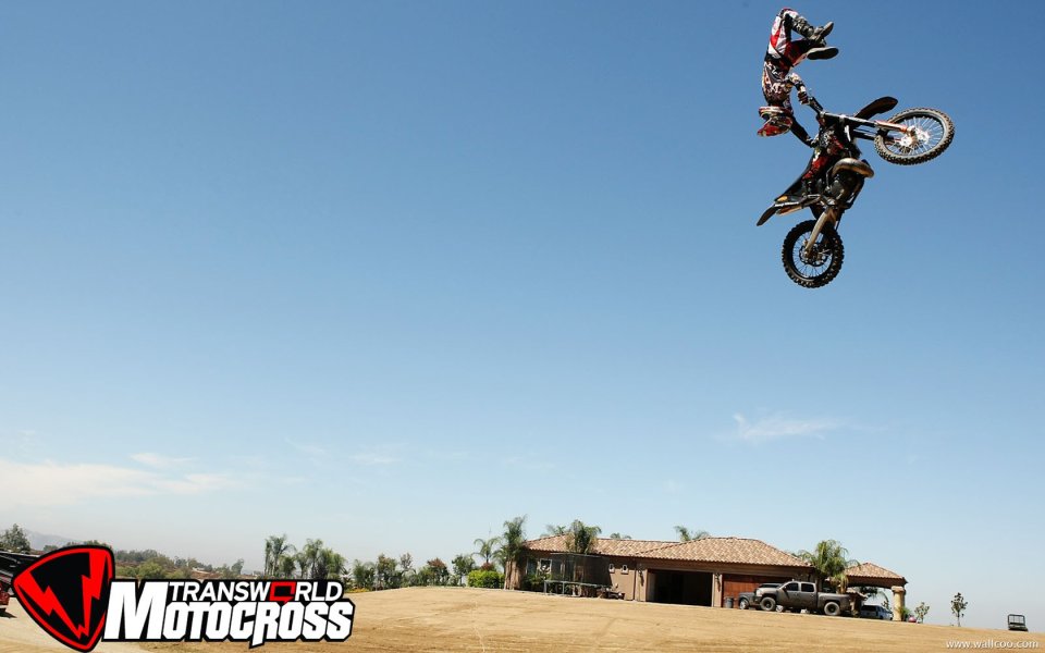 Motorcycle Stunt Performance Dynamic Action Under Blue Sky