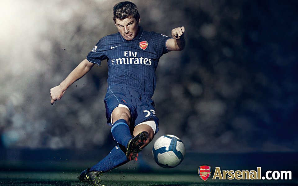 Arsenal Player Kicking Football Action Photo