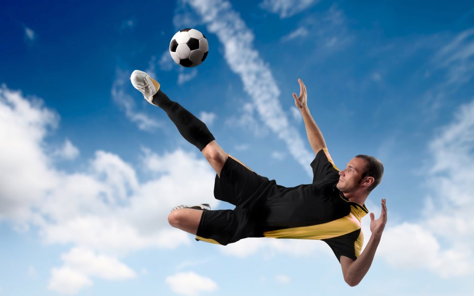 Football Player Bicycle Kick Shot Under Blue Sky