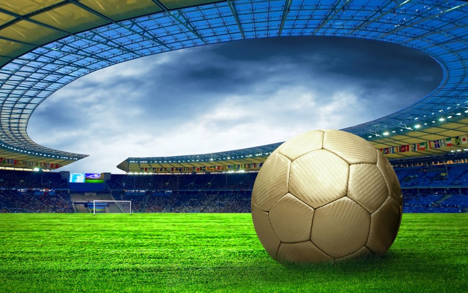 Golden Soccer Ball On Professional Football Stadium Lawn