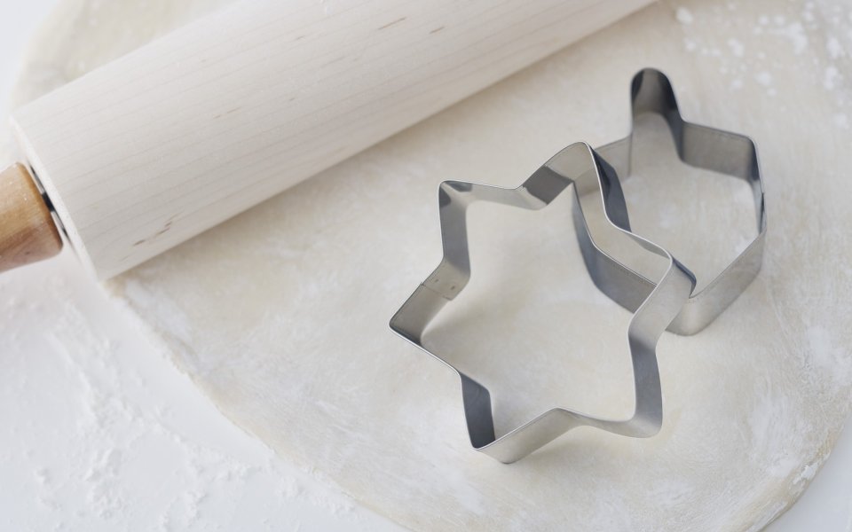 Star Cookie Cutter And Rolling Pin On Dough