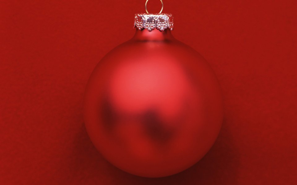 Red Christmas Ornament Close Up On Red Background