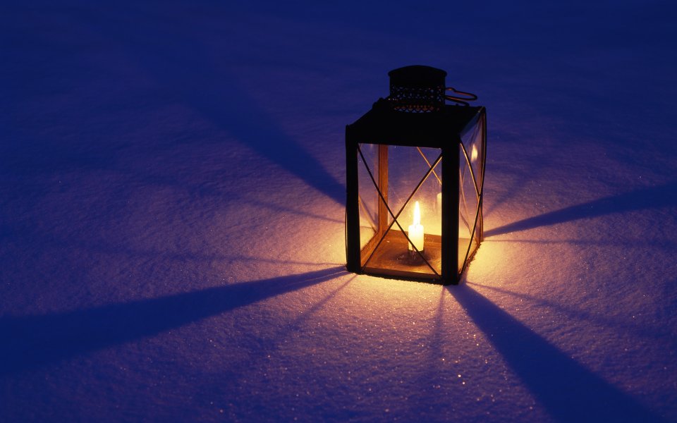 Glowing Lantern In Snowy Night