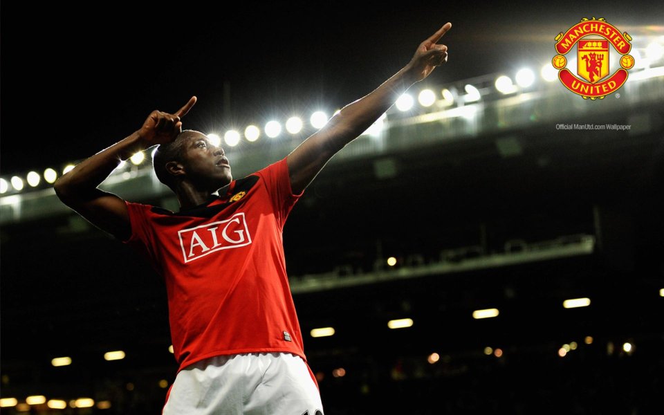 Manchester United Player Goal Celebration Old Trafford Night Wallpaper