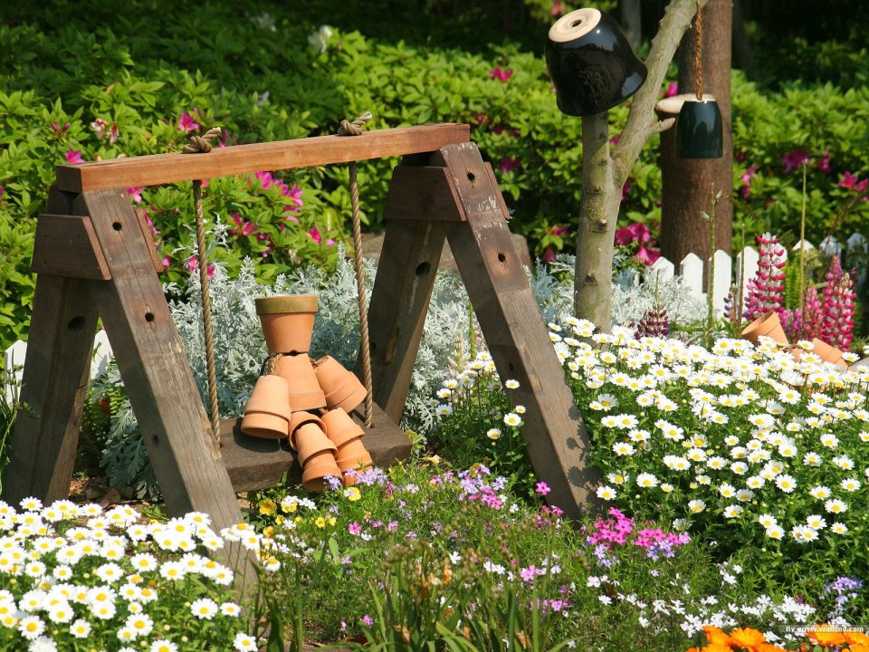 Japanese Garden Wooden Swing Surrounded By Blooming Flowers