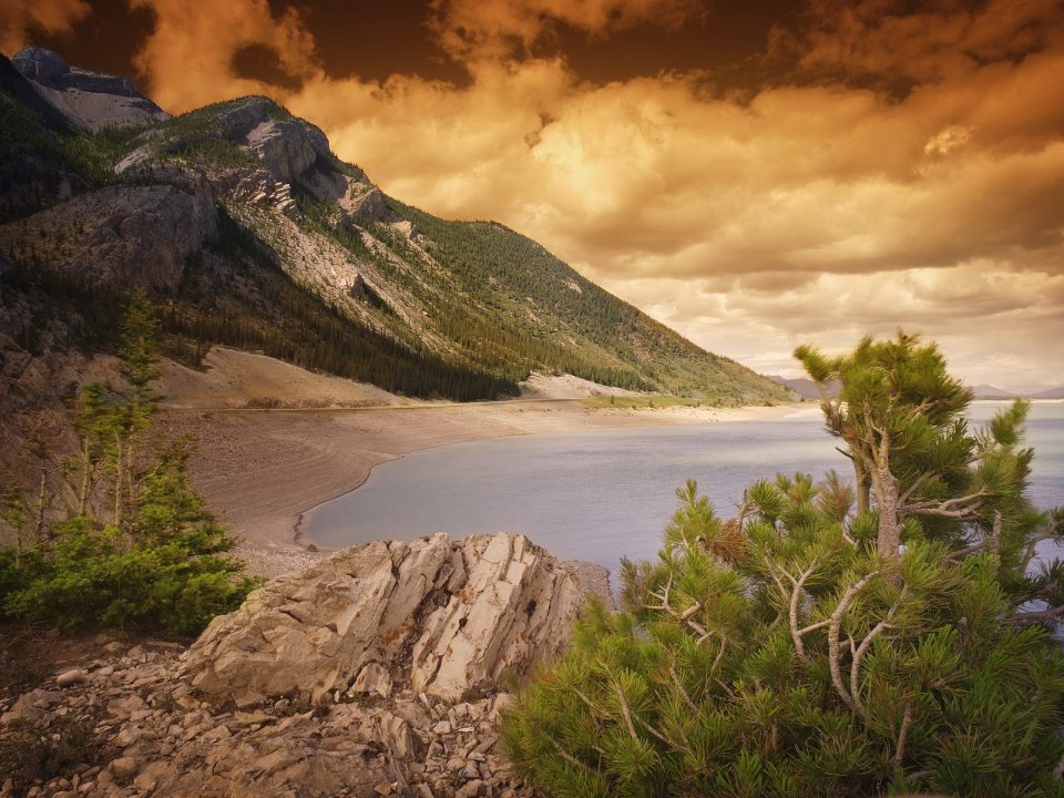 Rocky Coastline At Sunset Mountain Lake