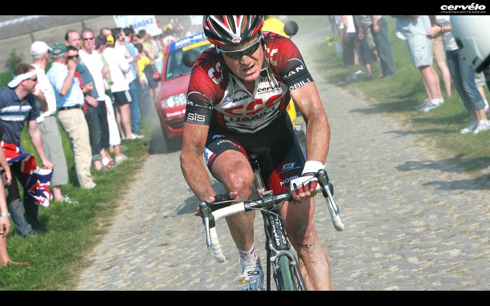 Tour De France Cyclist Racing On Cobblestone Road