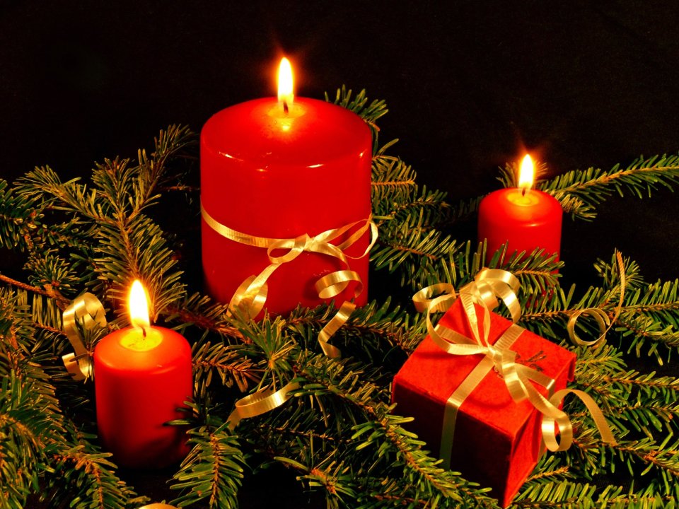 Burning Red Christmas Candles With Pine Branches And Gift