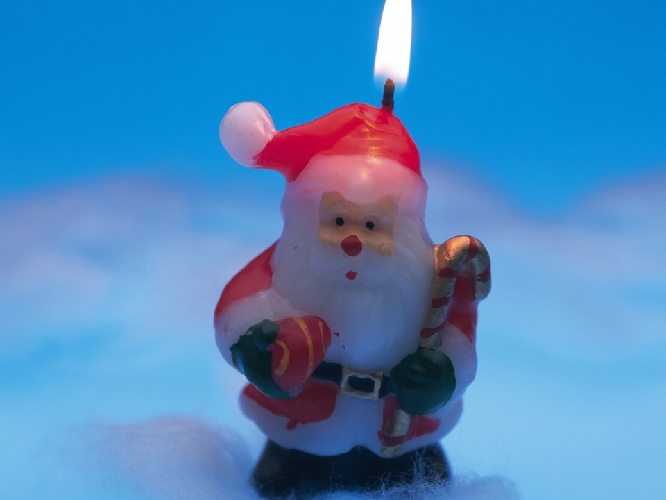Santa Claus Candle Burning Blue Background