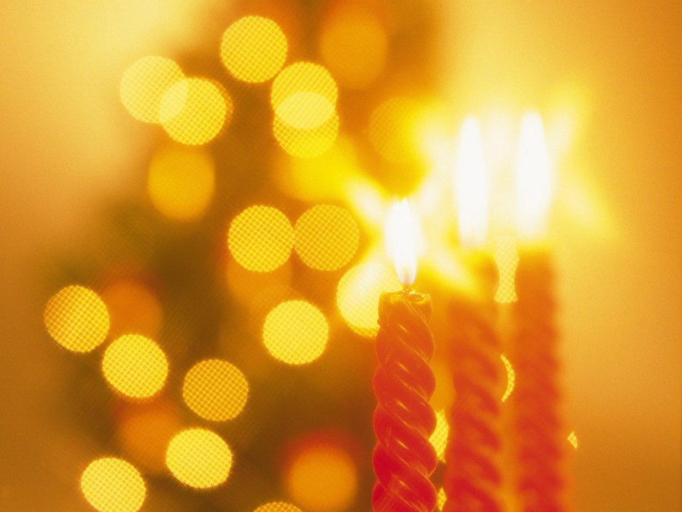 Red Spiral Christmas Candles With Bokeh Background