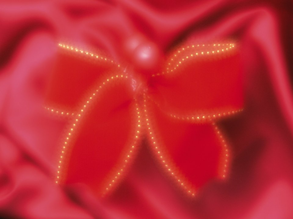 Red Silk Bow Golden Bokeh Background