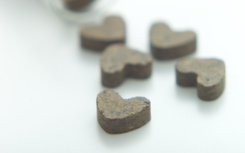 Close Up Of Heart Shaped Chocolates On White Background