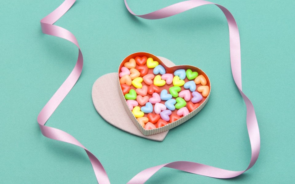 Heart Shaped Candy Box With Pink Ribbon On Mint Green Background