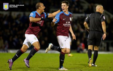 Aston Villa Players Celebrate Goal On Football Stadium