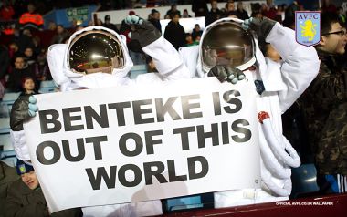 Aston Villa Fans In Astronaut Suits Hold Banner For Benteke