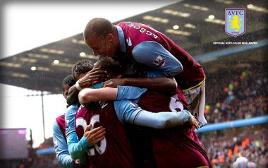 Aston Villa Players Celebrating Goal In Rain