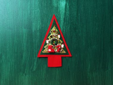 Handmade Felt Christmas Tree On Green Wood Background
